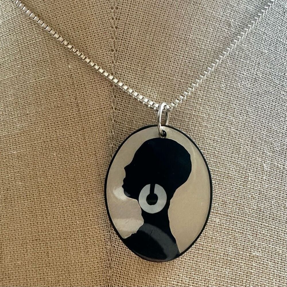 Woman profile pendant necklace